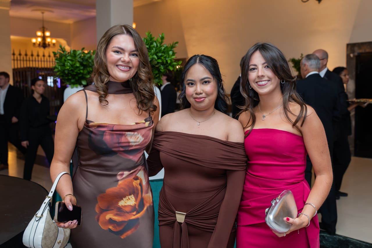 Three colleagues in evening dresses smiling at the Behavox annual gala