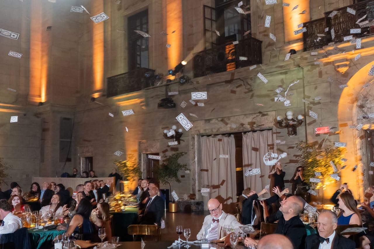 Confetti falling over the gala tables